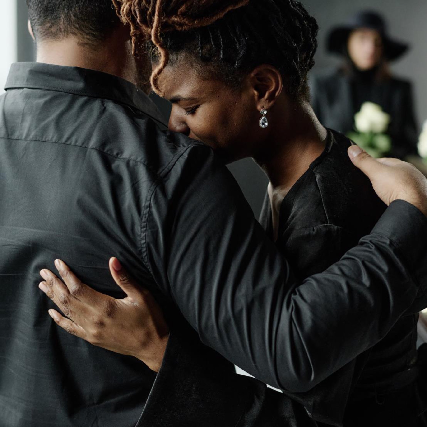 A bereaved family member receiving support